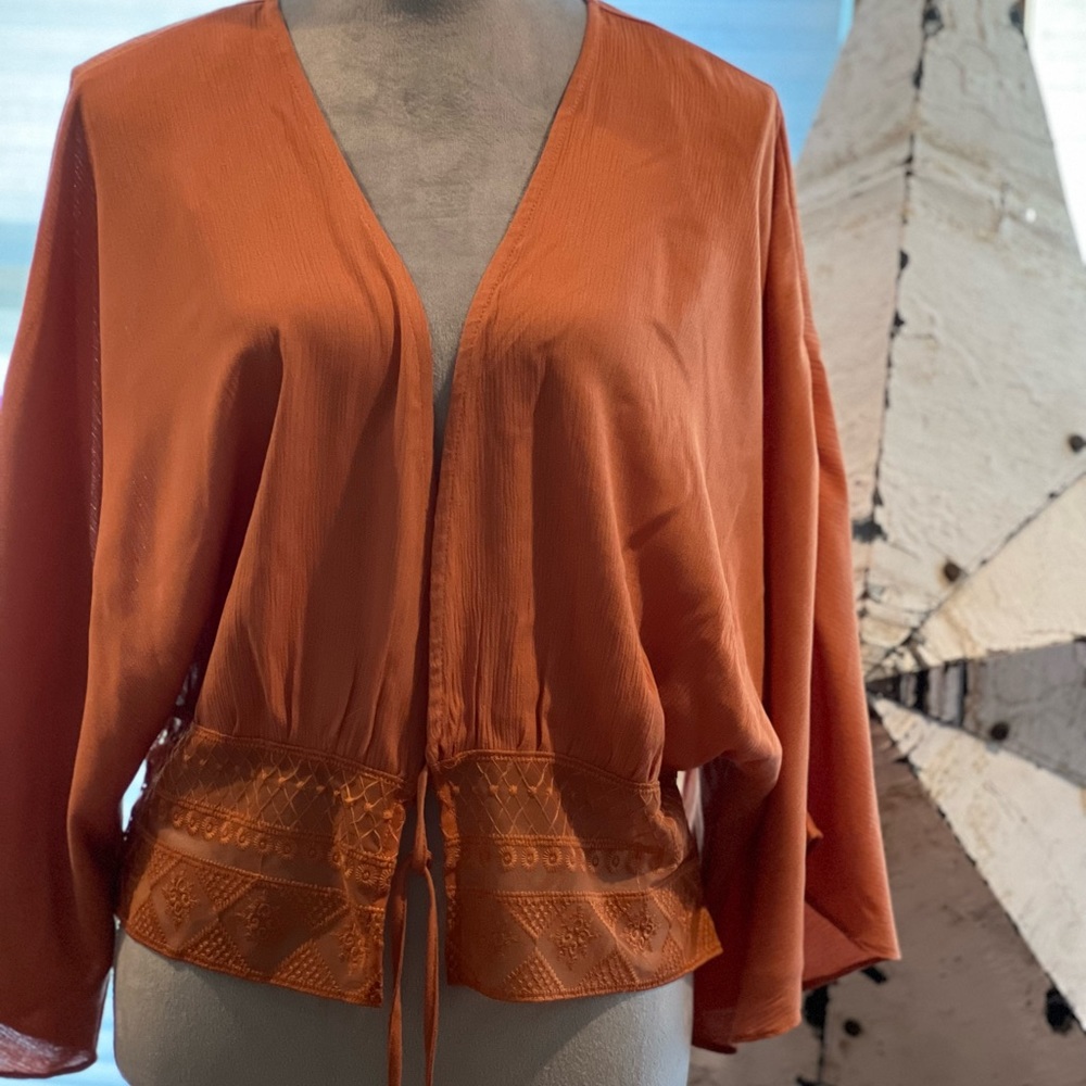 Light Shrug with sleeves.